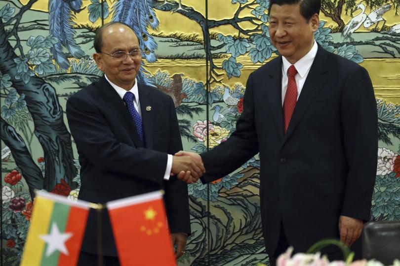 Chinas President Xi Jinping R and Myanmars President Thein Sein shaking hands. China is the biggest investor in Myanmar. Photo REUTERS - China Daily